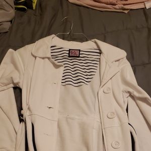 White with blue accent coat